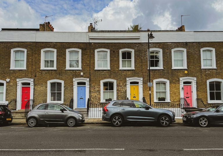 Row of period terraced houses with colourful front doors