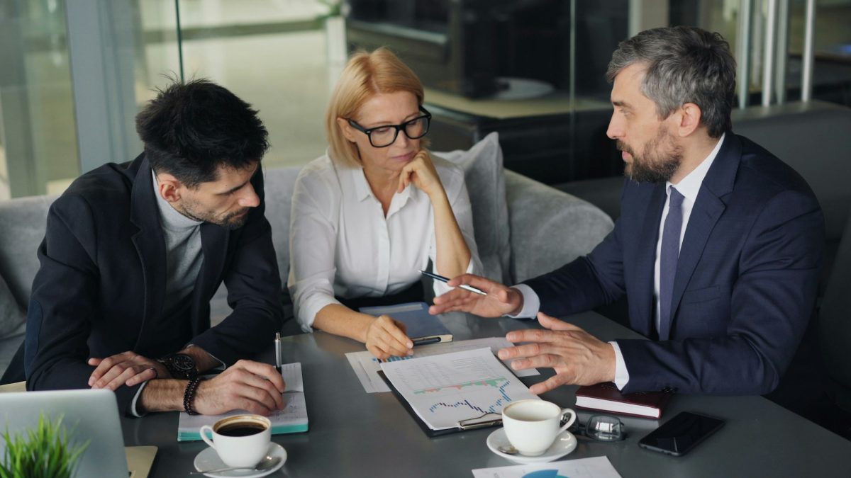 Property management professionals discussing a lettings agreement